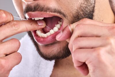 maintaining proper oral care, flossing dental crown