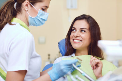 women maintaining her dental implants